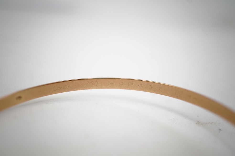 Cartier, a gold bangle, 'Trinity de Cartier'